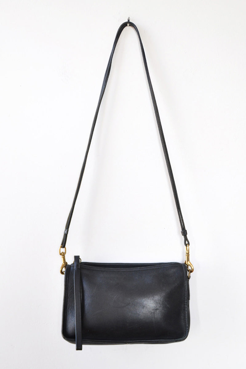 Simple black leather crossbody bag with zipper