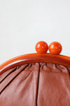 Amber Leather Kisslock Clutch