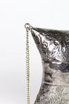 etched metal evening bag detail