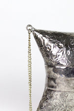 etched metal evening bag detail