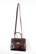 crocodile embossed top handle bags