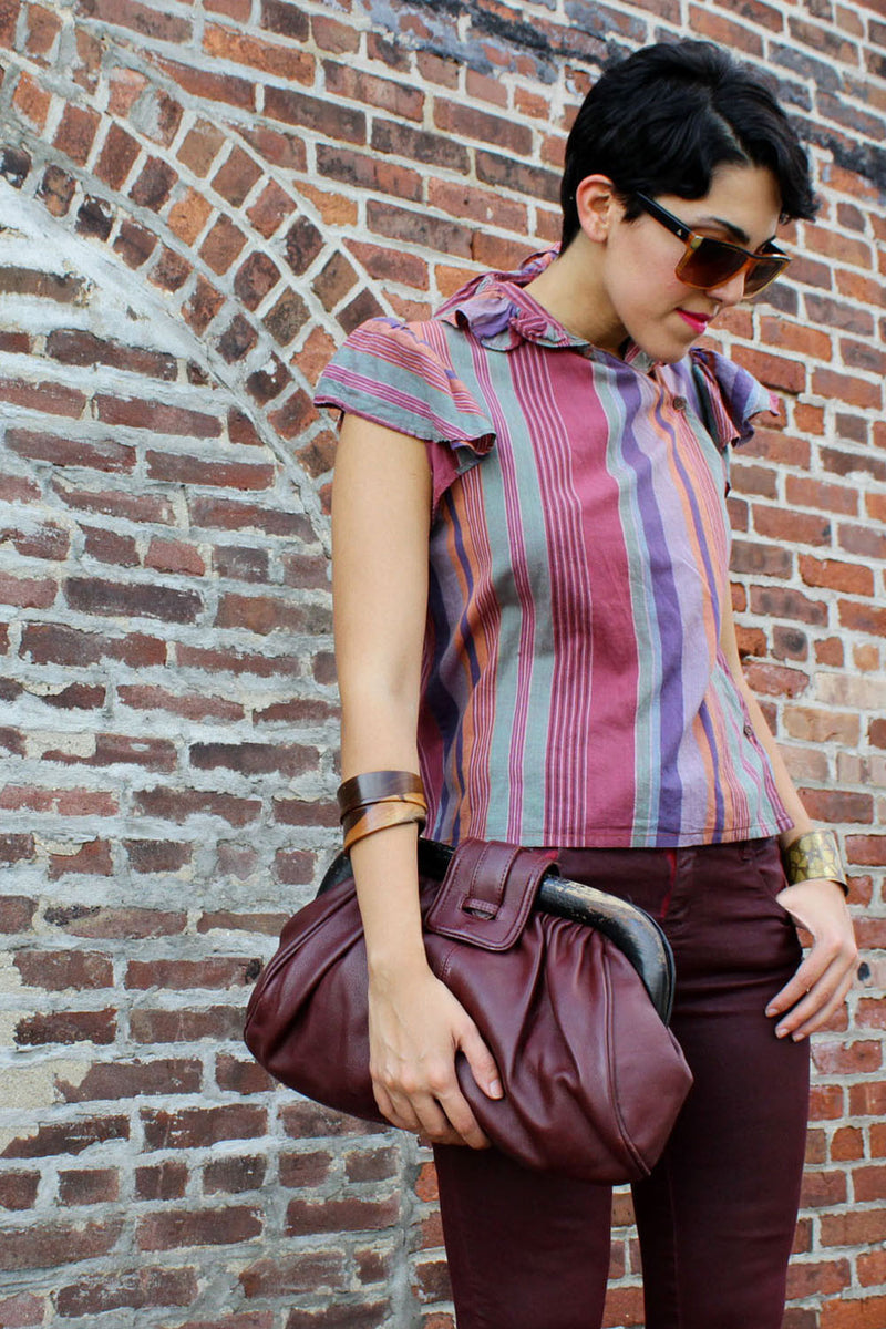 oversized maroon leather clutch