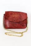 red tooled leather purse