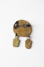 Face Off Brass Pin