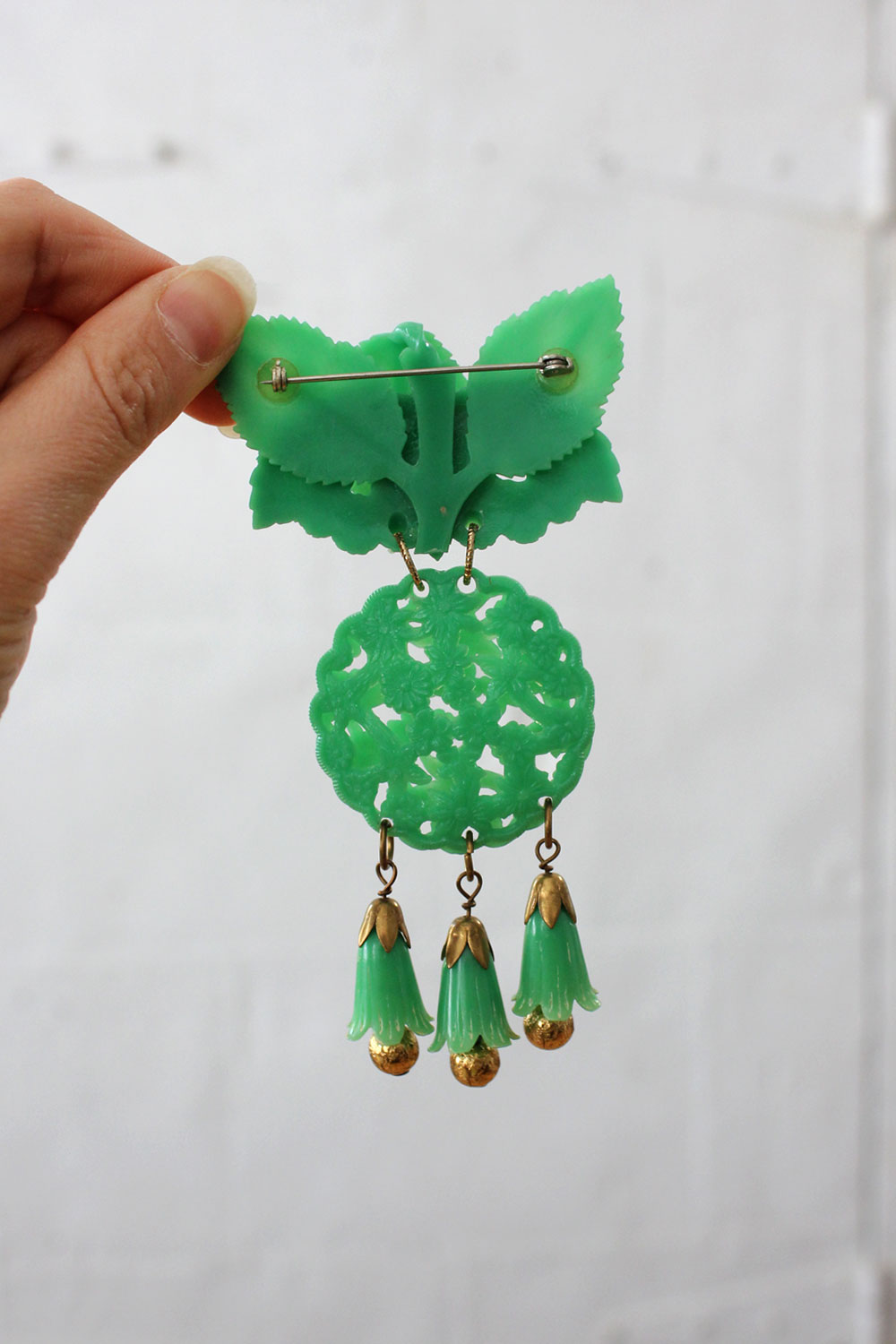 Carved Green Bell Brooch